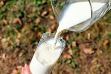 Milk being poured into a glass.