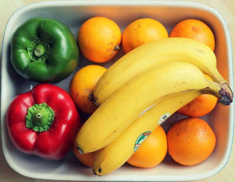 Variety of fruits in a while dish.