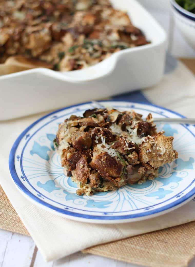 A plate of food on a table, with Sausage and Strata