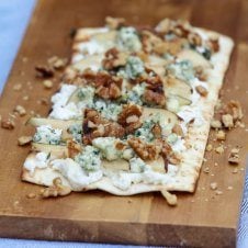 A tasty pear and blue cheese grilled pizza with ricotta, walnuts and thyme.