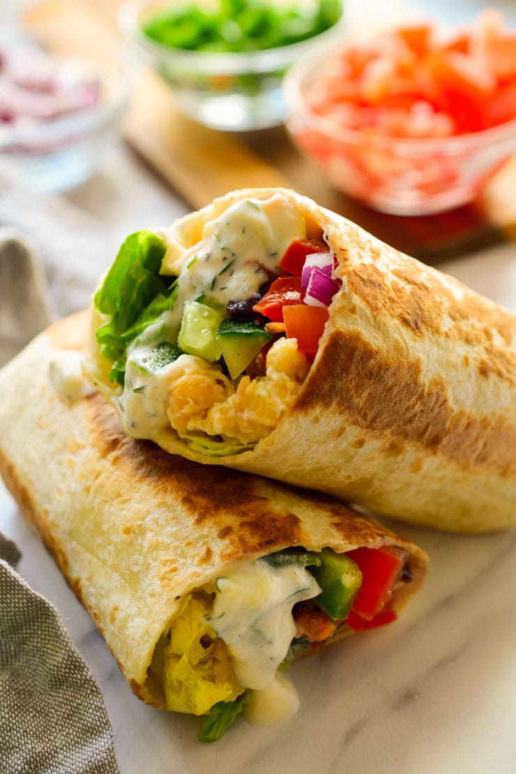 Two wraps filled with veggies.
