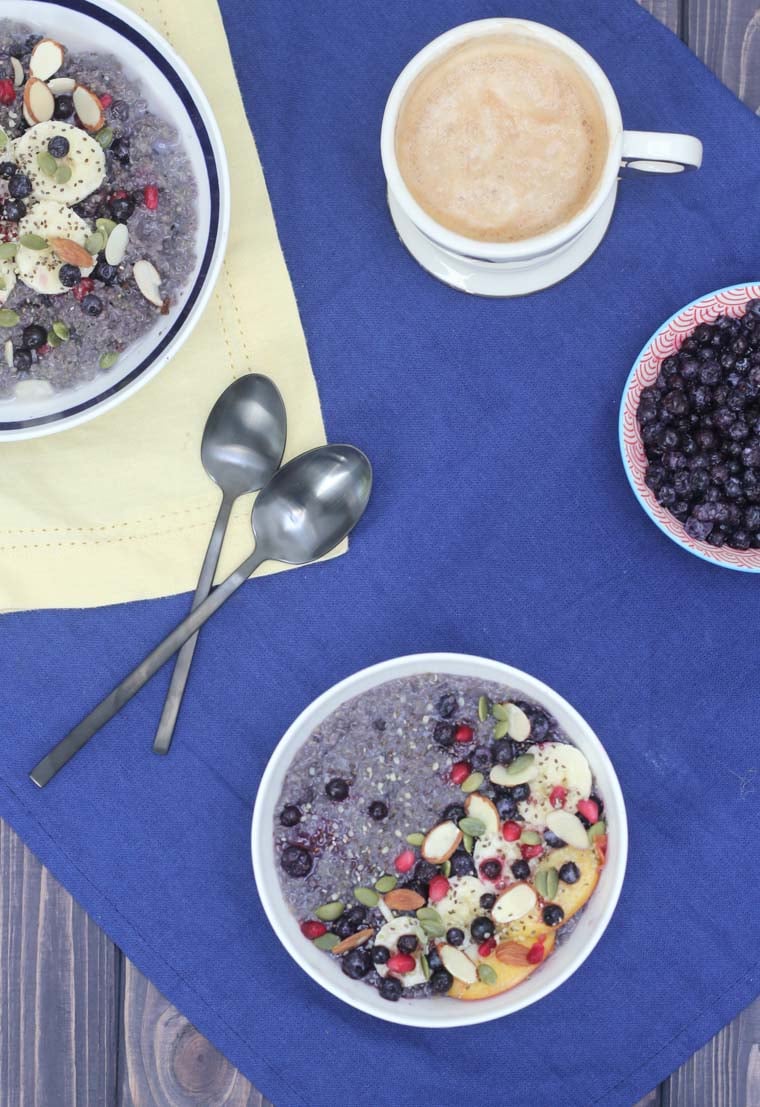 An overhead photo of a table with two blueberry quinoa.
