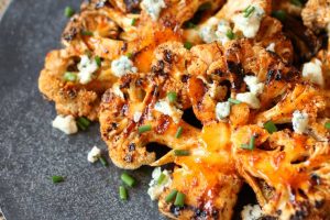 These easy vegetarian gluten free buffalo cauliflower steaks are the perfect dish for a healthy meatless dinner option.