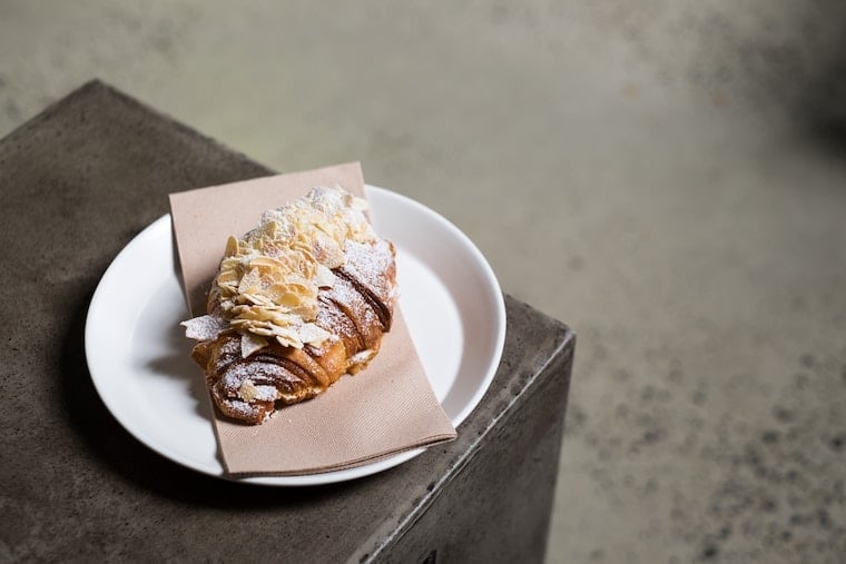 Almond croissant on a plate with a napkin.