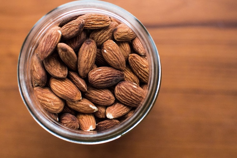 Overhead photo of a jar of almonds.