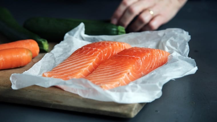 Two pieces of raw salmon fillets.