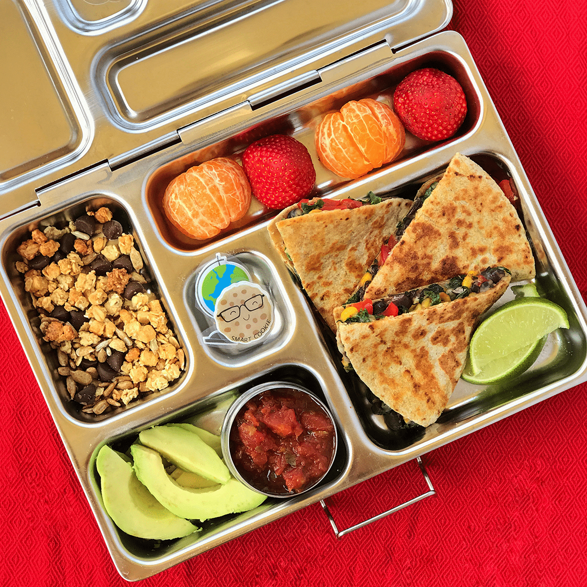 Quesadillas served in a lunch box.