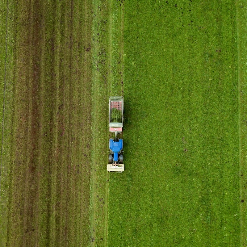 Tractor driving through field.