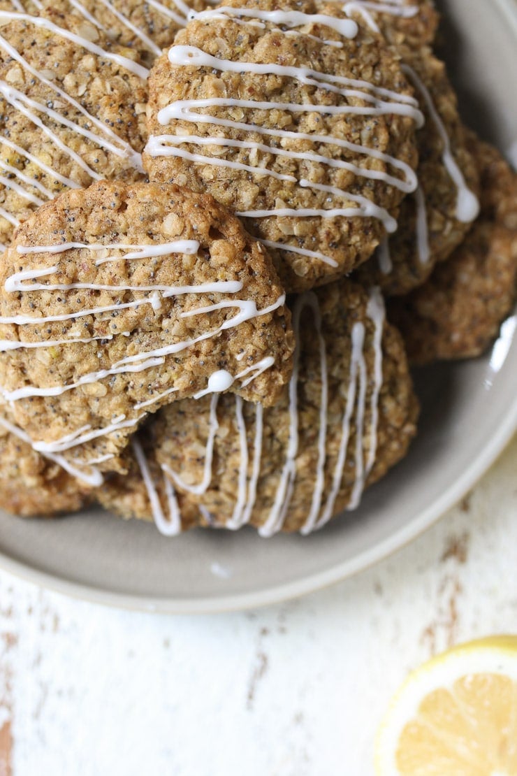 Pile of lemon poppyseed lactation cookies on a plate.