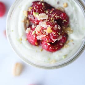 Cheesecake parfait topped with berries.