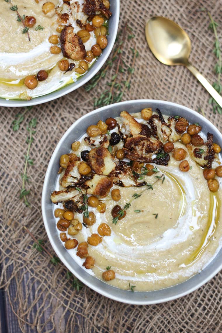 birds eye view of cauliflower soup topped with chickpeas