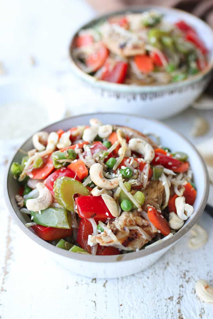 two bowls of chicken stir fry