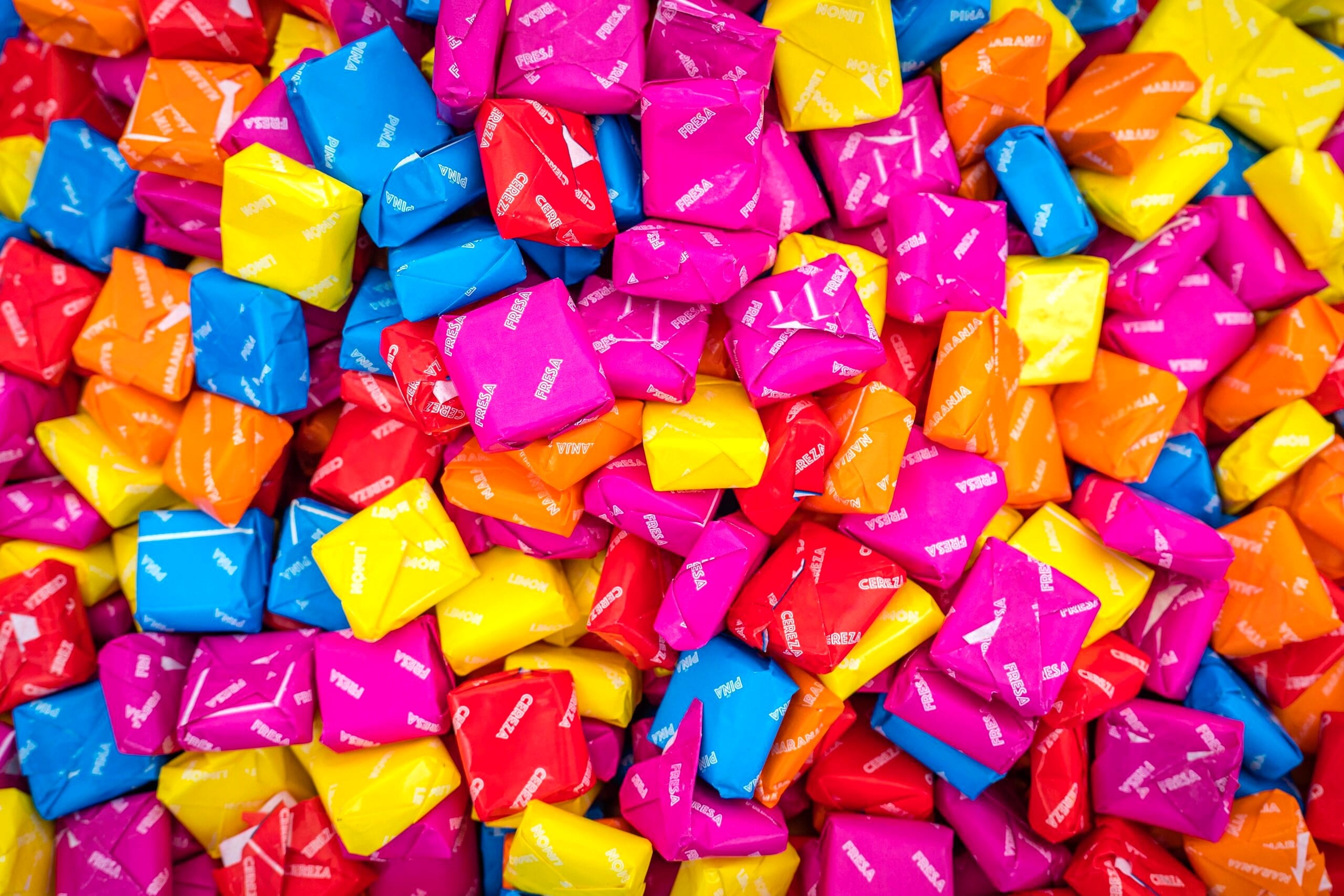 Close up image of colourful packed candy.