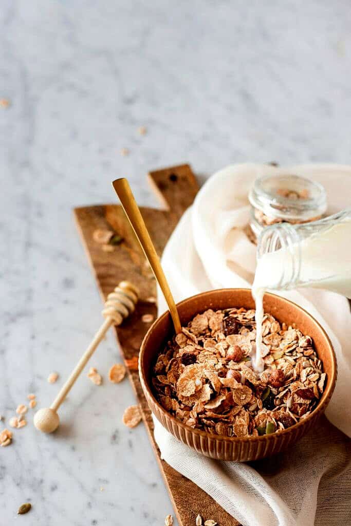 Picture of a bowl of cereal with milk being porn inside.