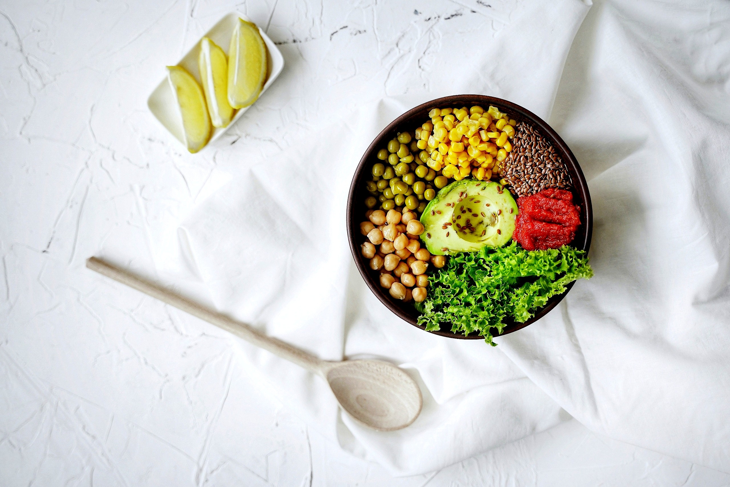 Colourful grain bowl with avocado and vegetables.